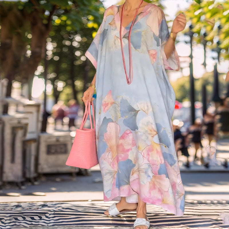 Loose, long dress with floral pattern and half-length sleeves