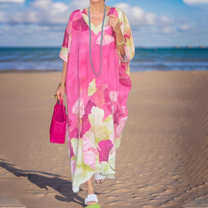 Loose, long dress with floral pattern and half-length sleeves