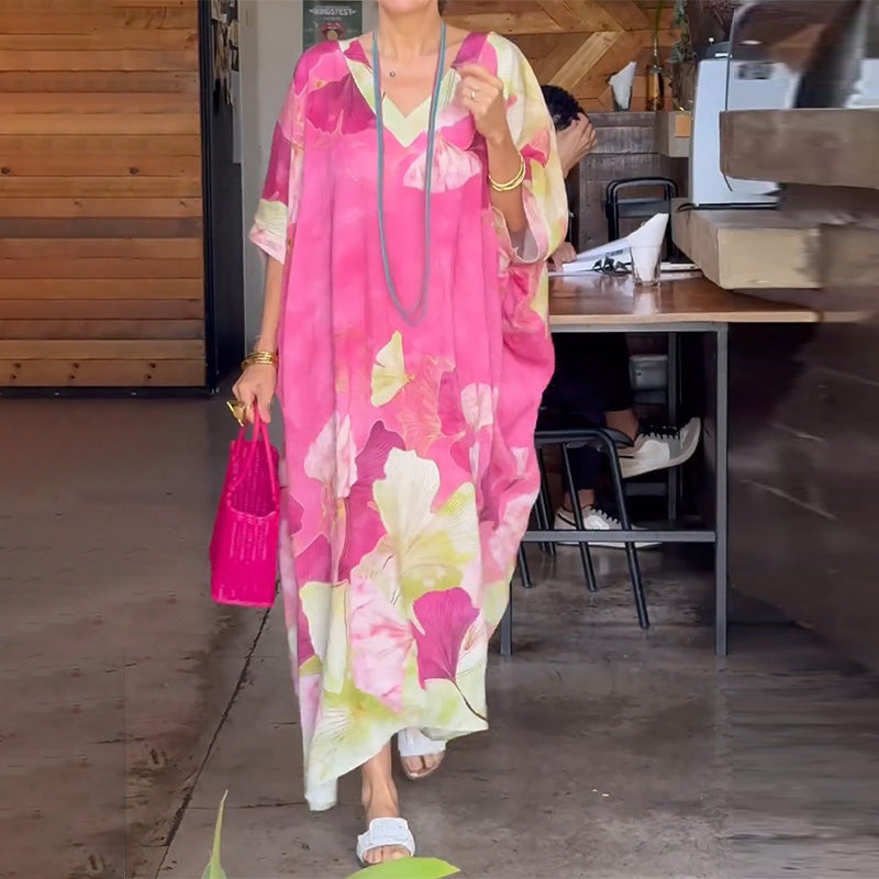 Loose, long dress with floral pattern and half-length sleeves