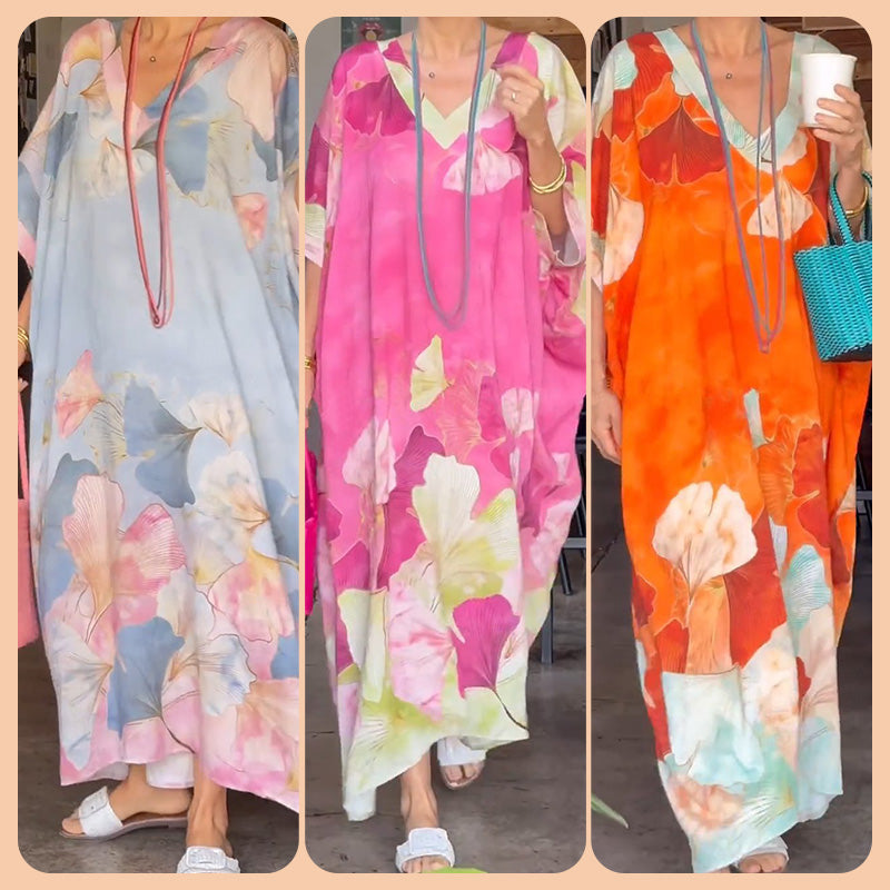 Loose, long dress with floral pattern and half-length sleeves