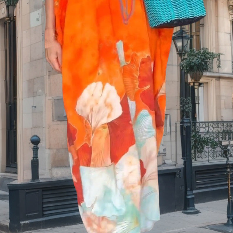 Loose, long dress with floral pattern and half-length sleeves